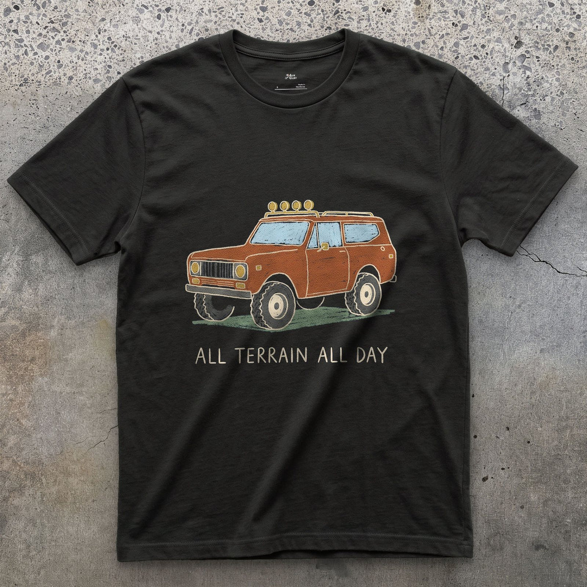 All Terrain All Day, Orange Wagon design on a Black Gildan Softstyle t-shirt