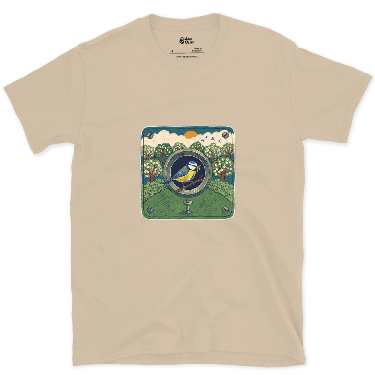 An Orchard Through a Nest Box Hole design on a Sand Gildan Softstyle t-shirt