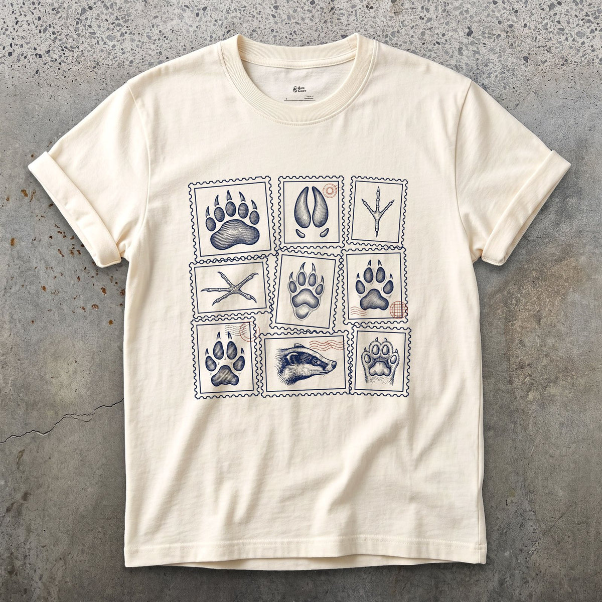 Four Signs Read Off the Trail design on a Natural Gildan Softstyle t-shirt