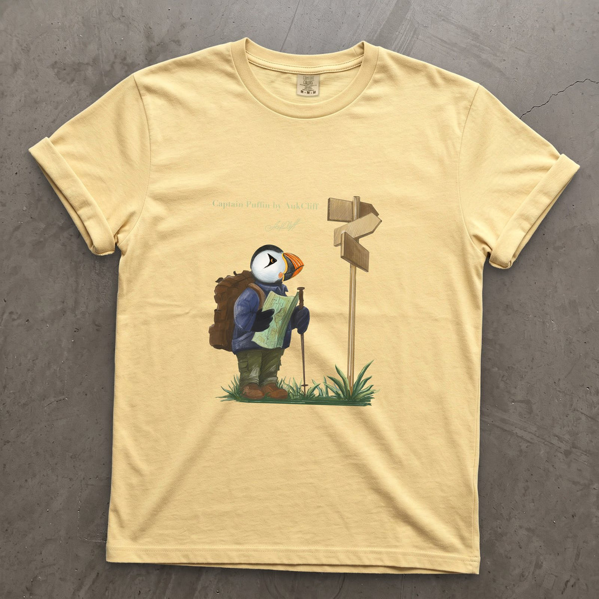 Captain Puffin Hiker on a Butter Comfort Colors t-shirt