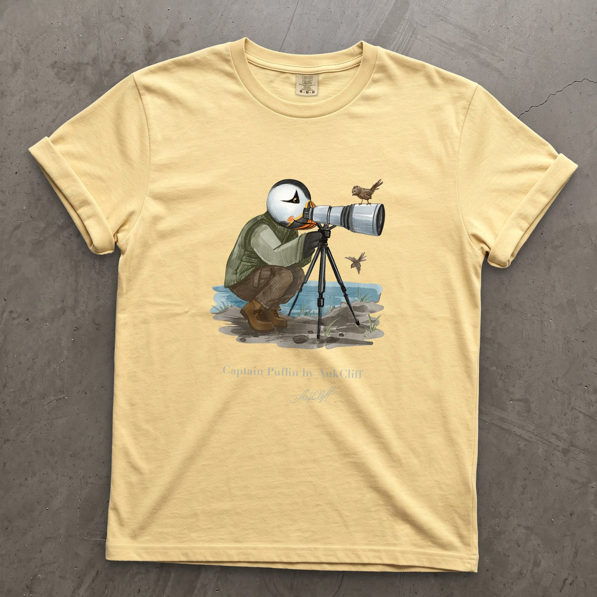 Captain Puffin Bird Photographer on a Butter Comfort Colors t-shirt