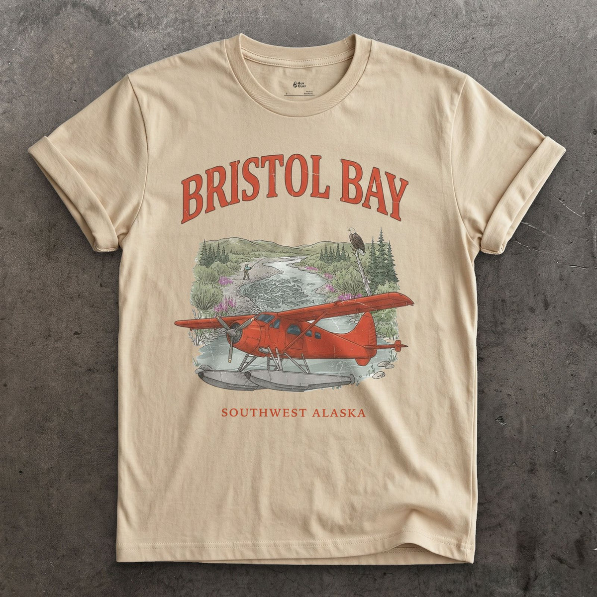 Bristol Bay Bush Plane design on a Sand Gildan Softstyle t-shirt