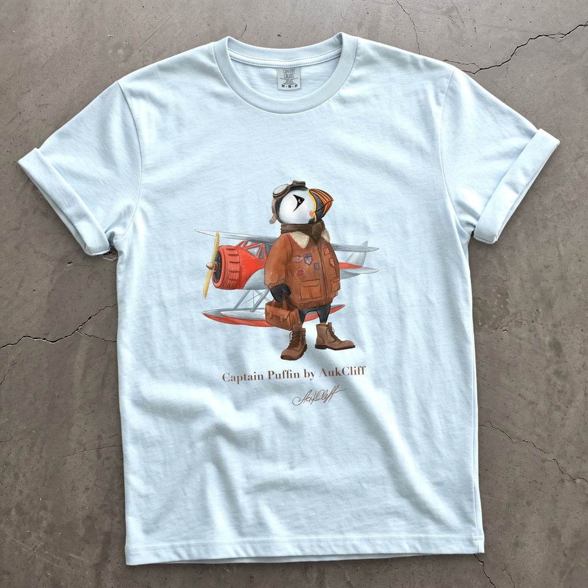 Captain Puffin Bush Pilot on a Chambray Comfort Colors t-shirt