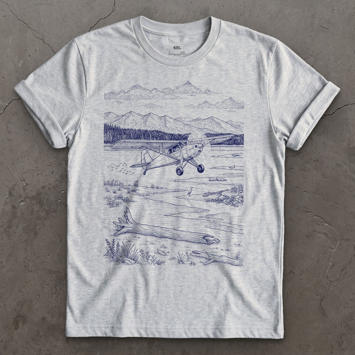 Bush Plane on the Tidal Flat design on a Sport Grey Gildan Softstyle t-shirt