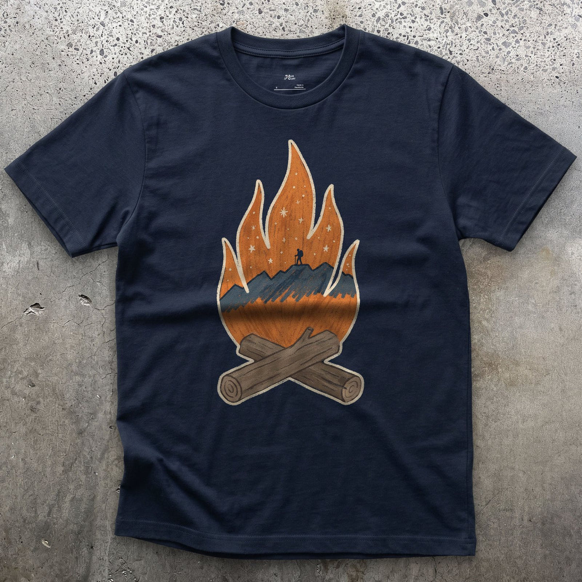 A Lone Hiker Held by Firelight design on a Navy Gildan Softstyle t-shirt