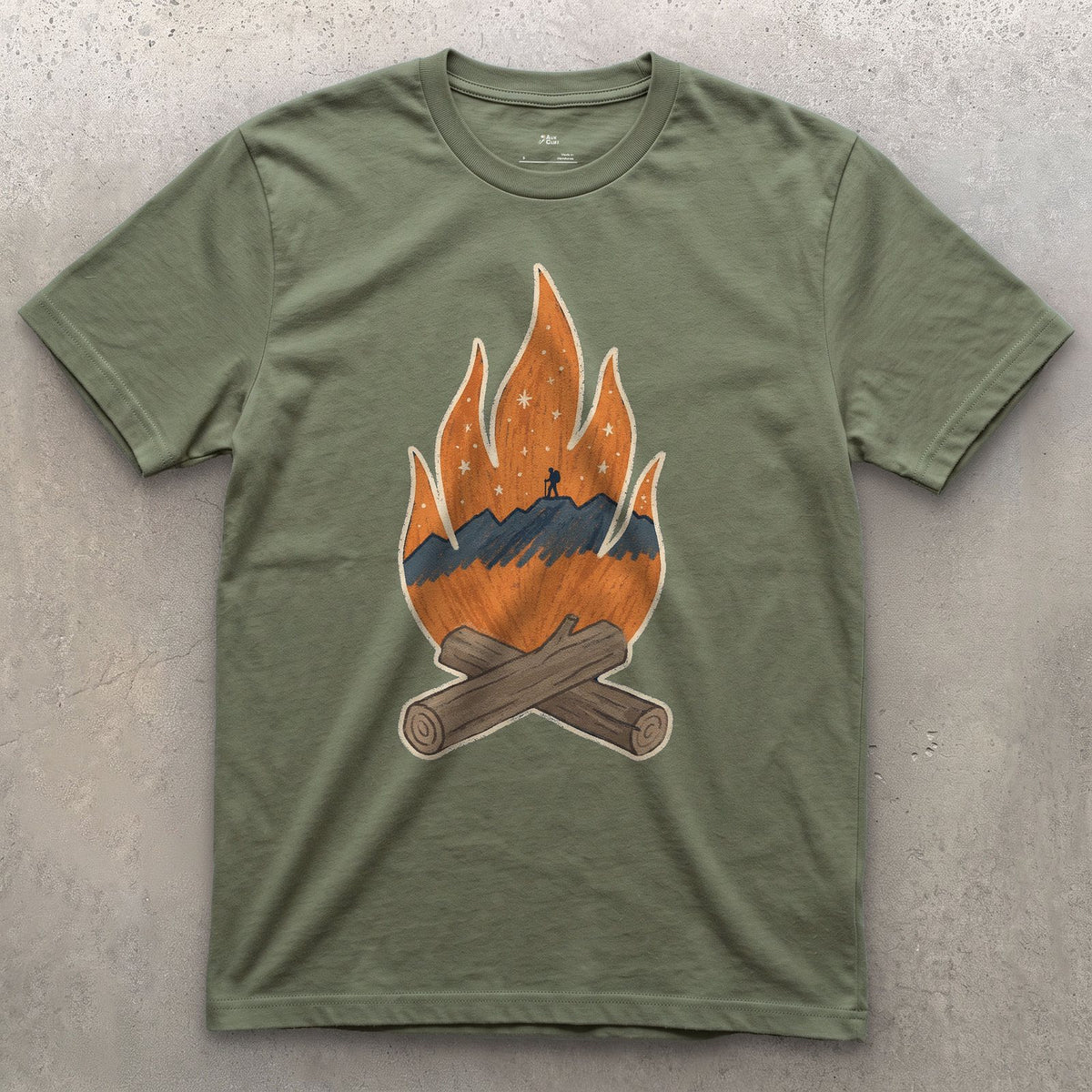A Lone Hiker Held by Firelight design on a Military Green Gildan Softstyle t-shirt