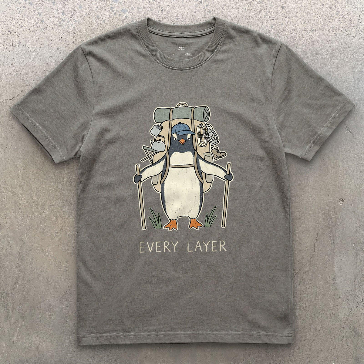 Doesn't Trust the Forecast, Penguin Hiker design on a Charcoal Gildan Softstyle t-shirt
