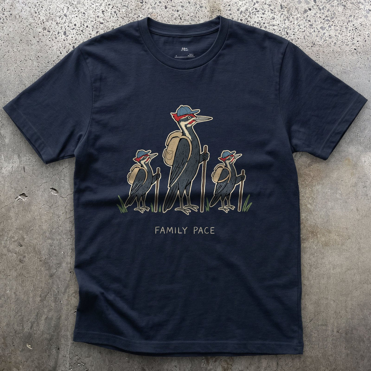Woodpeckers Slowing to a Family Pace design on a Navy Gildan Softstyle t-shirt
