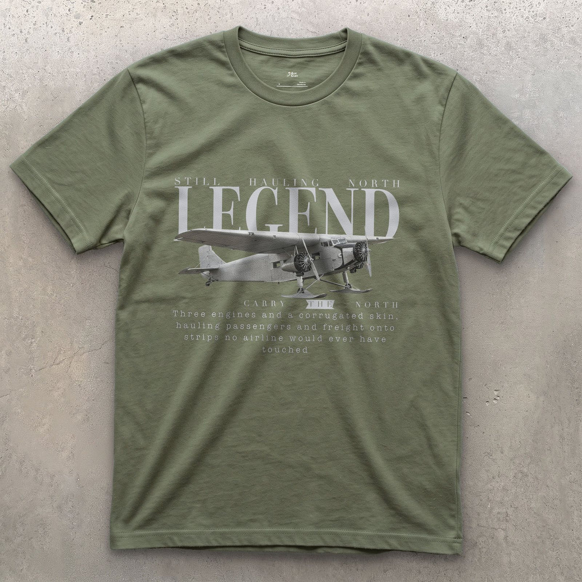 Ford Trimotor on Skis design on a Military Green Gildan Softstyle t-shirt