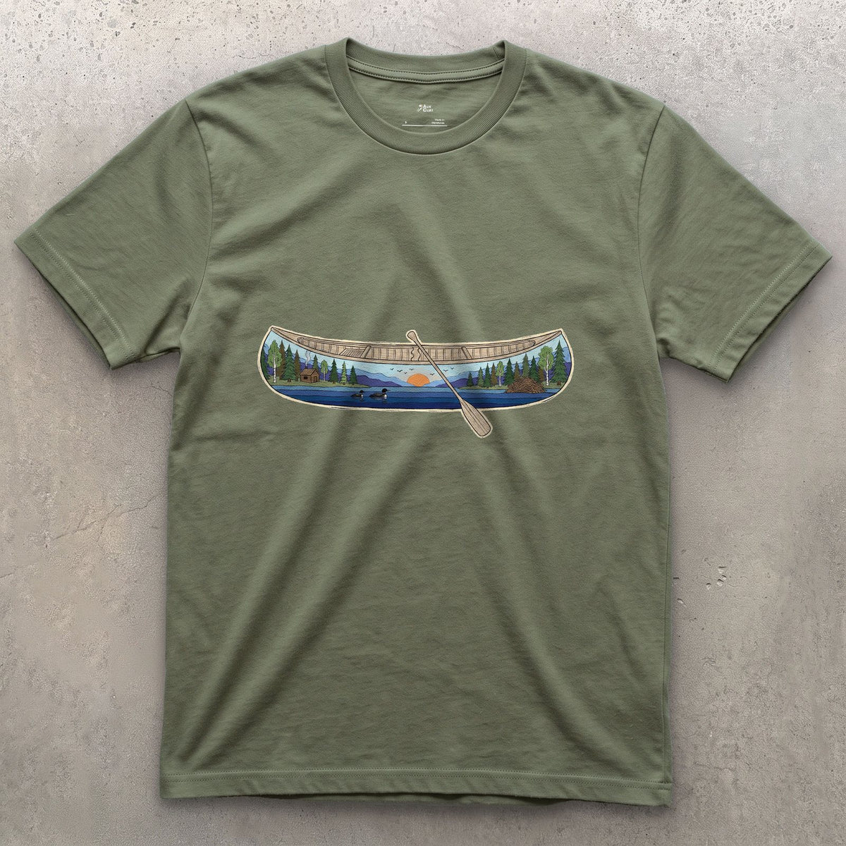 Forest Lake at Dusk, Open Canoe design on a Military Green Gildan Softstyle t-shirt