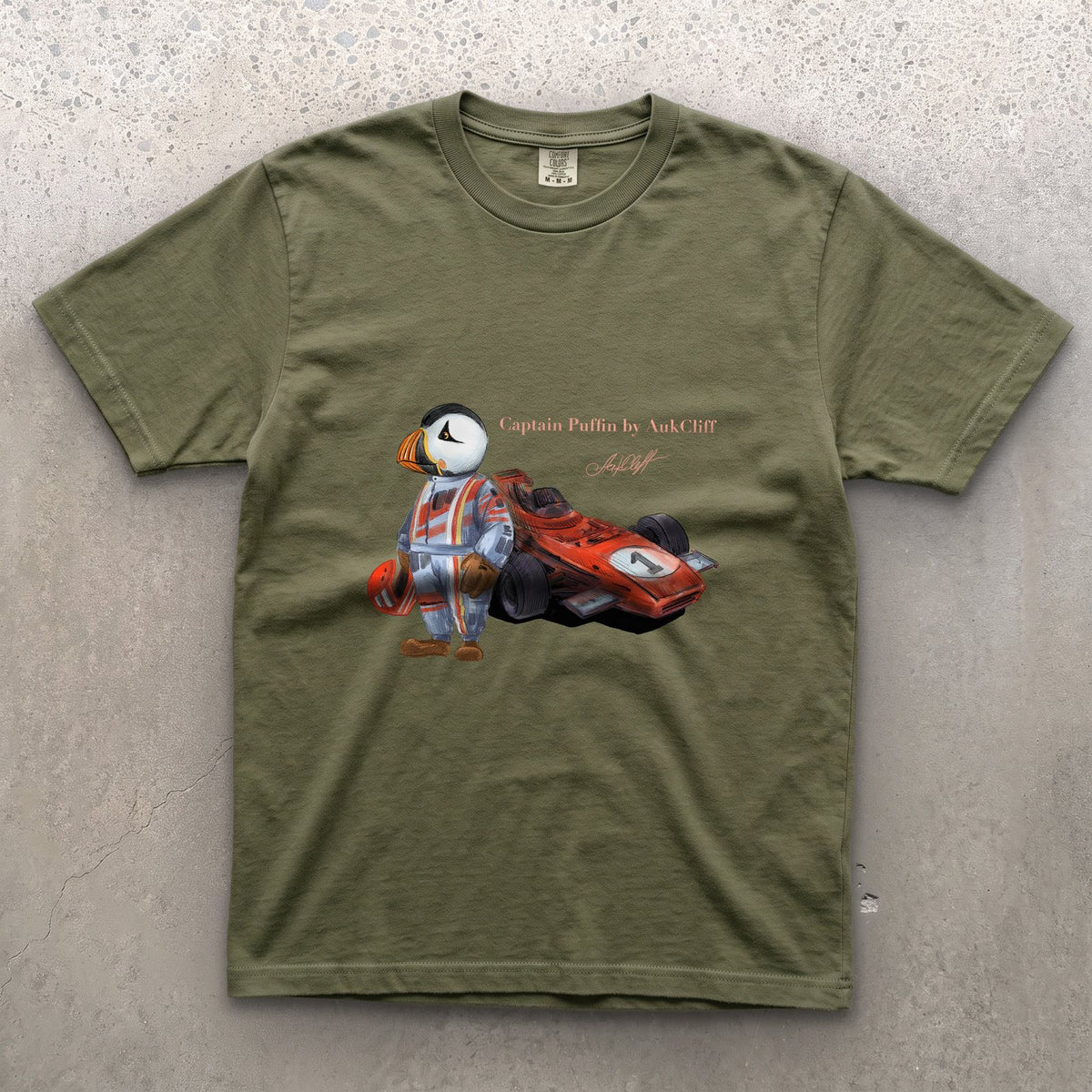 Captain Puffin Formula Racer on a Moss Comfort Colors t-shirt