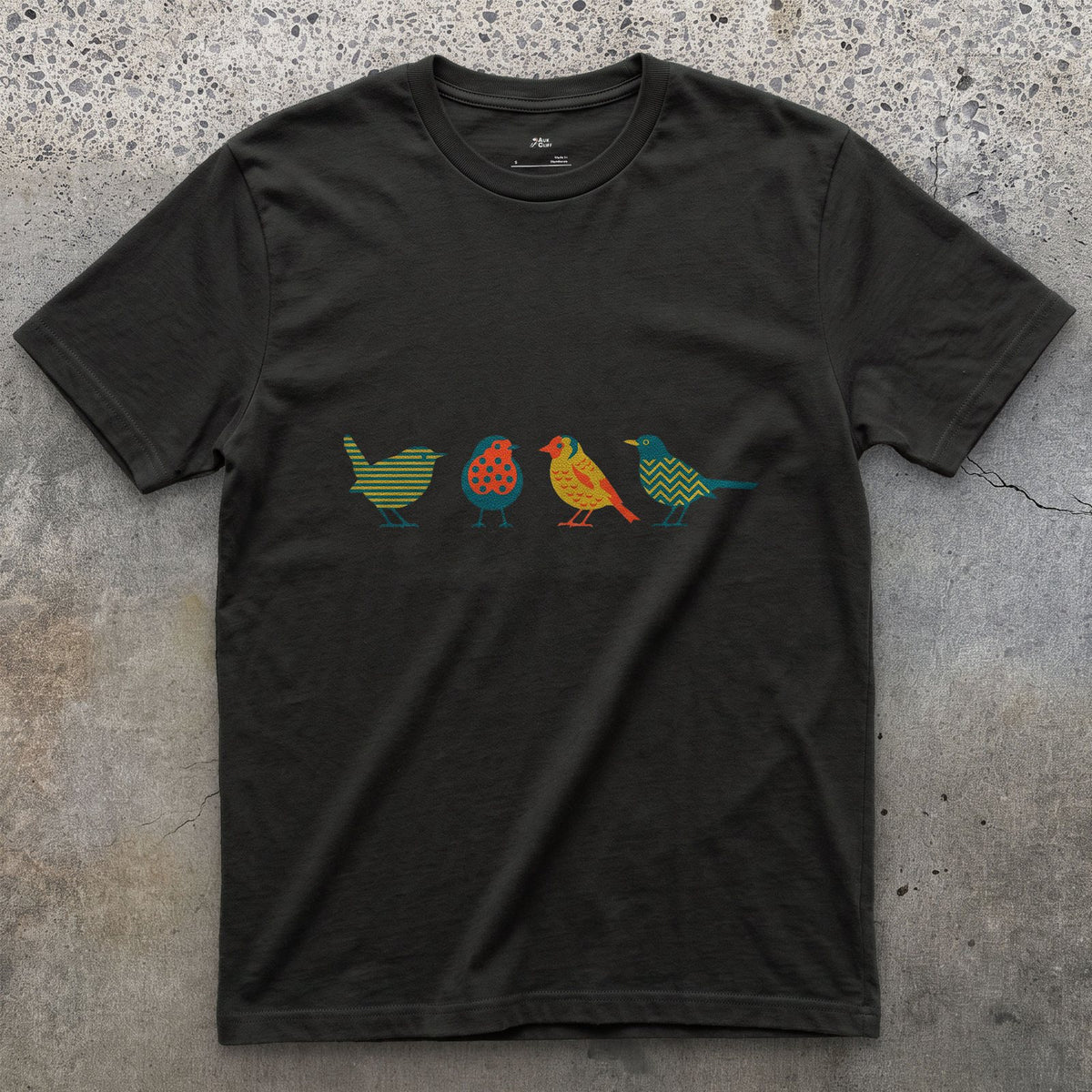 Four Birds in a Row, Each in Its Own Pattern design on a Black Gildan Softstyle t-shirt