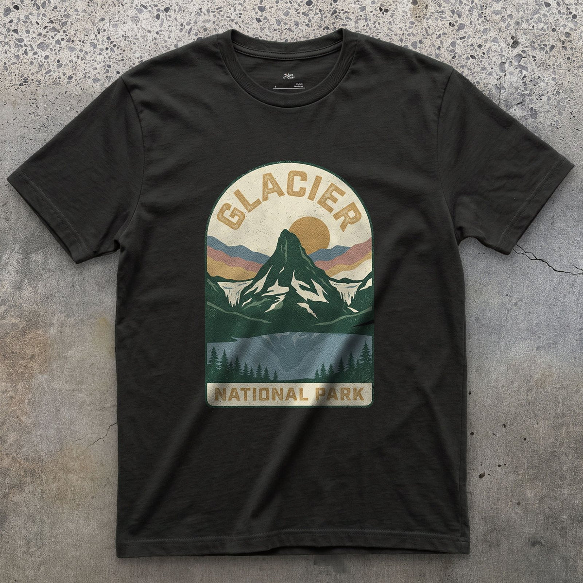 Glacier National Park Badge design on a Black Gildan Softstyle t-shirt
