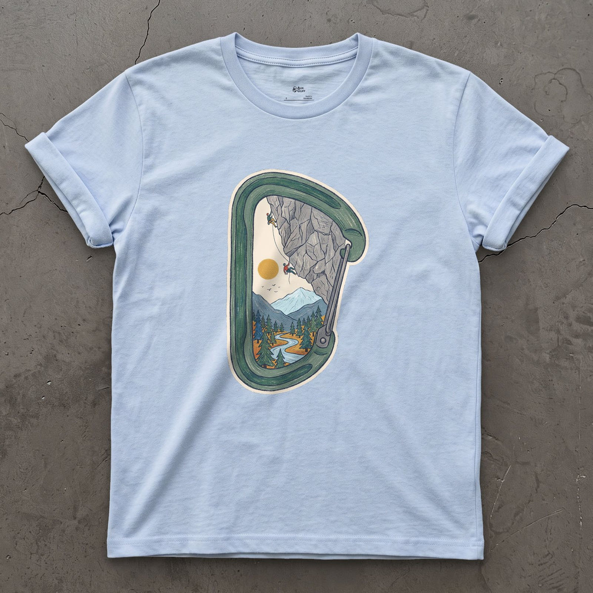Granite Wall Through a Carabiner design on a Light Blue Gildan Softstyle t-shirt