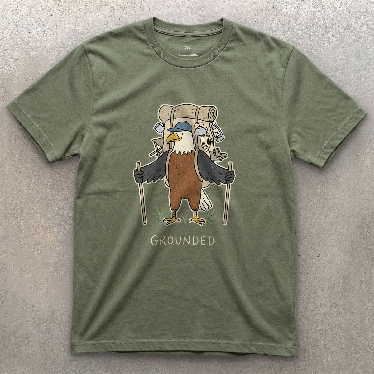 Too Heavy to Fly, Bald Eagle Hiker design on a Military Green Gildan Softstyle t-shirt