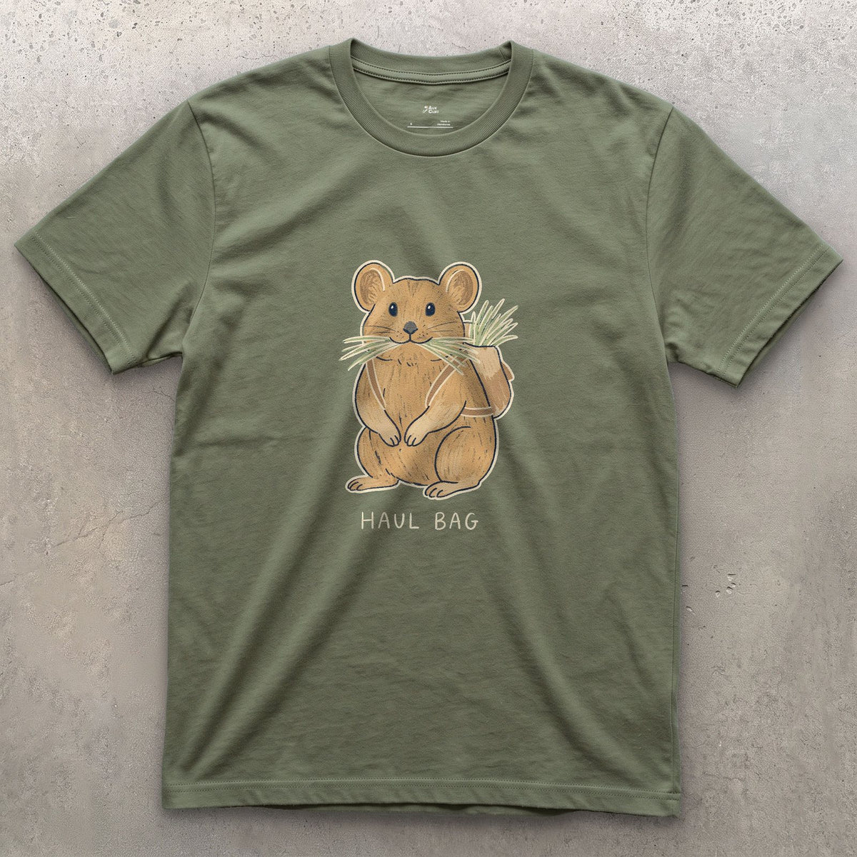 Big Wall Haul Bag, Pika Hauling Hay design on a Military Green Gildan Softstyle t-shirt
