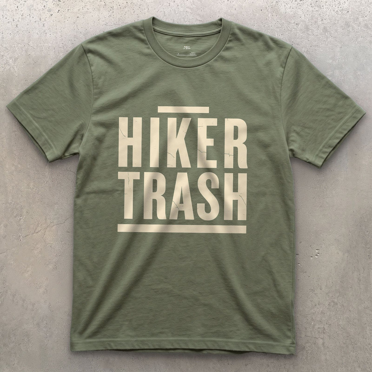 Hiker Trash Too Far In to Care design on a Military Green Gildan Softstyle t-shirt