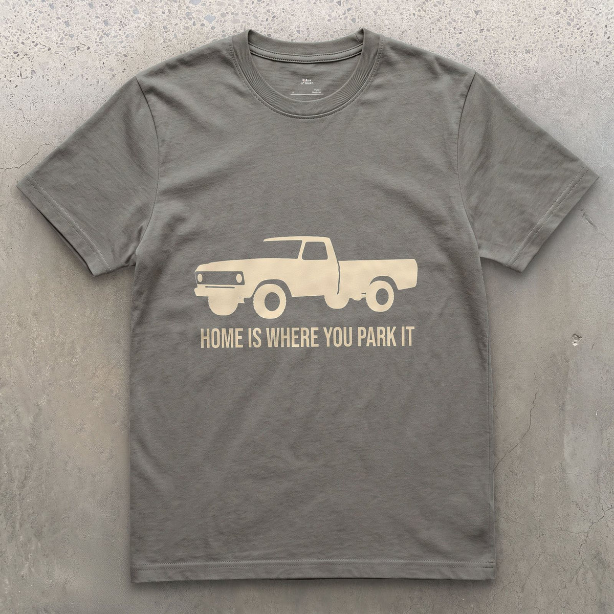 Home Is Where You Park It, Truck and Tent design on a Charcoal Gildan Softstyle t-shirt