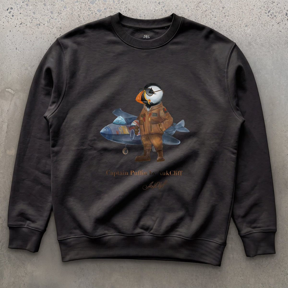 Captain Puffin Jet Pilot on a Black Cotton Heritage sweatshirt