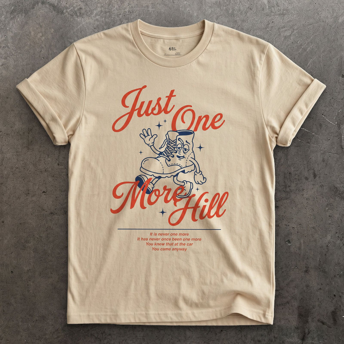 Just One More Hill, Determined Boot design on a Sand Gildan Softstyle t-shirt