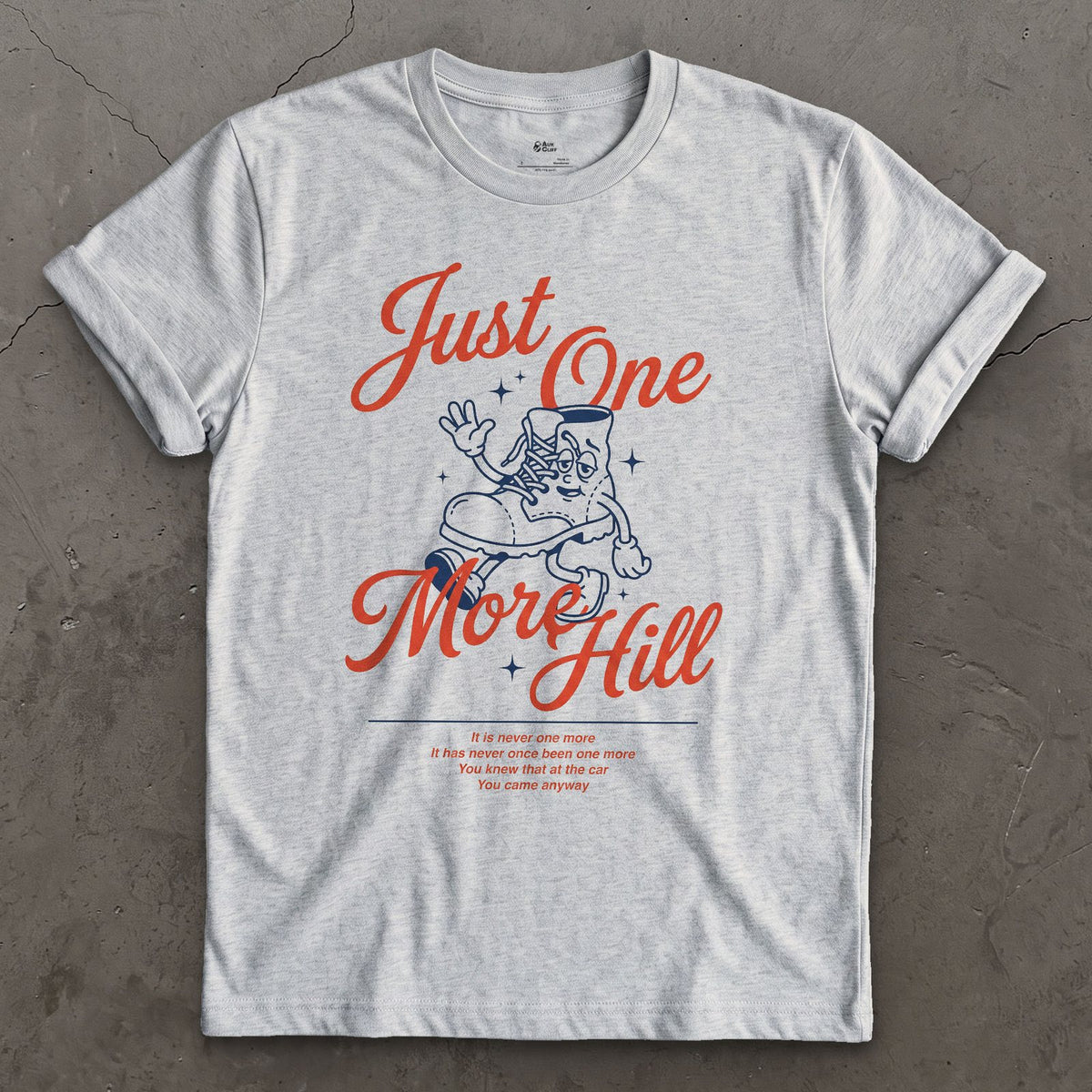 Just One More Hill, Determined Boot design on a Sport Grey Gildan Softstyle t-shirt