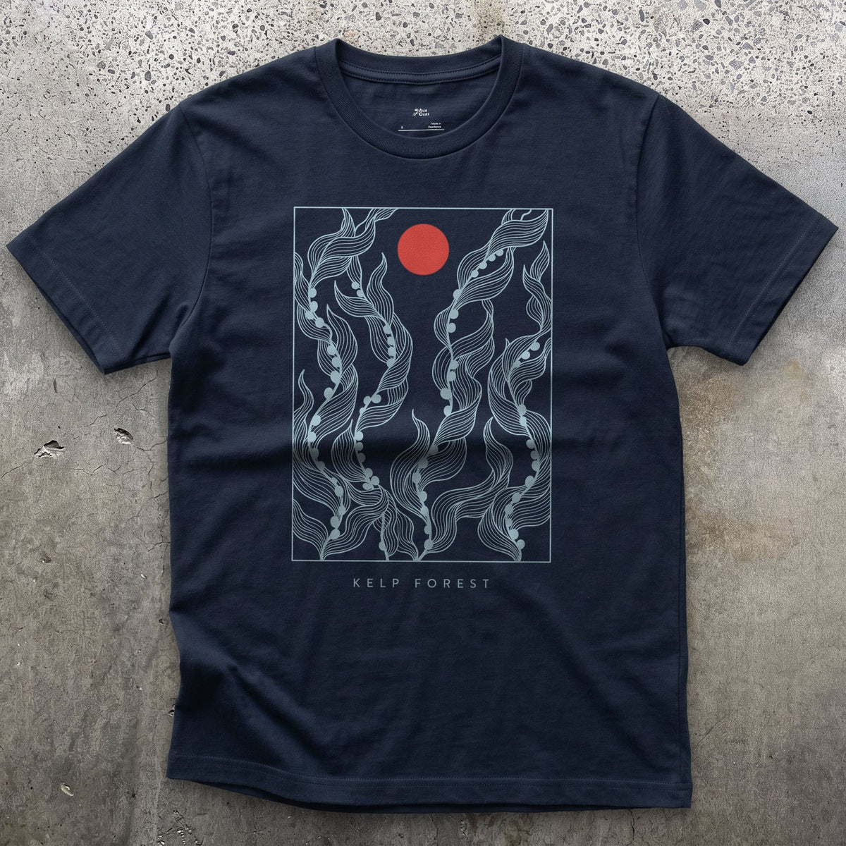Kelp Forest, Rising Through Open Water design on a Navy Gildan Softstyle t-shirt