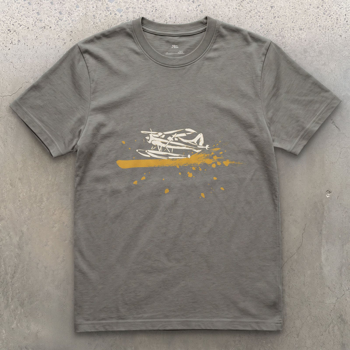 Landed on the Water design on a Charcoal Gildan Softstyle t-shirt