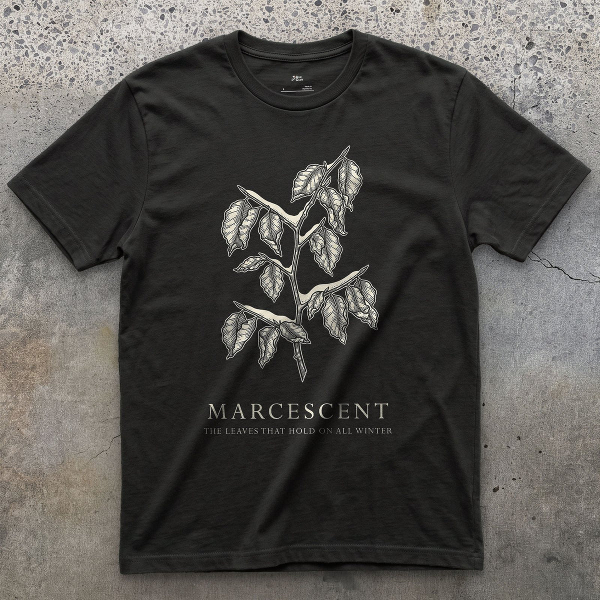 Marcescent design on a Black Gildan Softstyle t-shirt