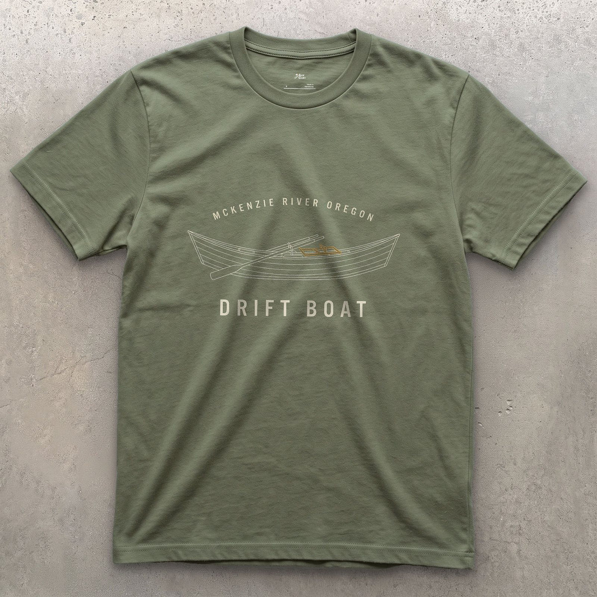 McKenzie River's Drift Boat Badge design on a Military Green Gildan Softstyle t-shirt
