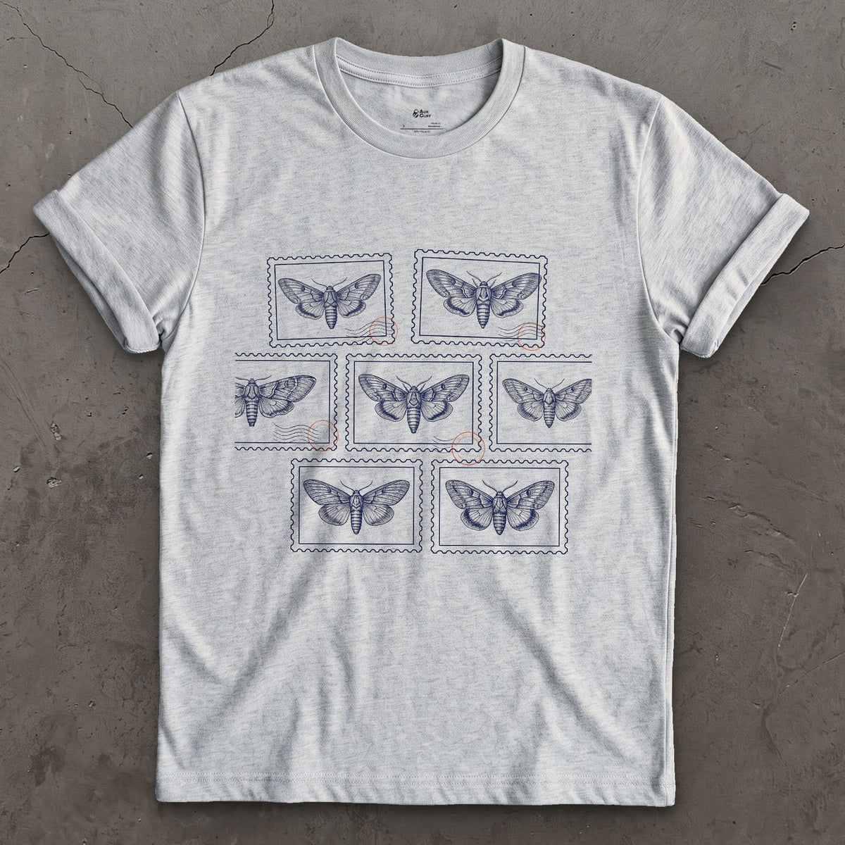 Seven Wild Moths, None of Them Named design on a Sport Grey Gildan Softstyle t-shirt