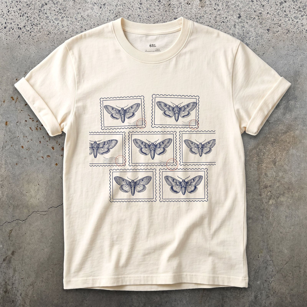 Seven Wild Moths, None of Them Named design on a Natural Gildan Softstyle t-shirt