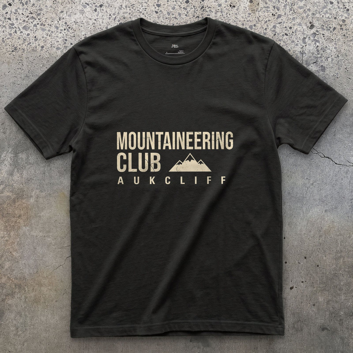 The Mountaineering Club Badge and Peaks design on a Black Gildan Softstyle t-shirt