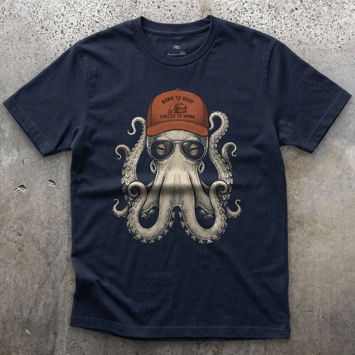 Born to Surf, Octopus in a Trucker Cap design on a Navy Gildan Softstyle t-shirt