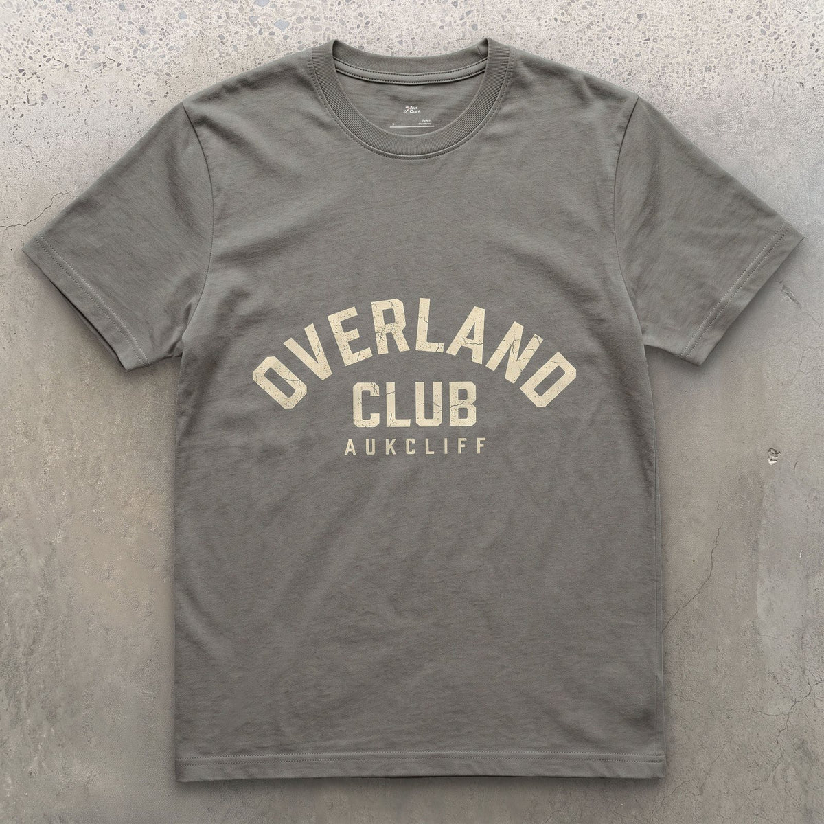 Overland Club Arch Badge design on a Charcoal Gildan Softstyle t-shirt