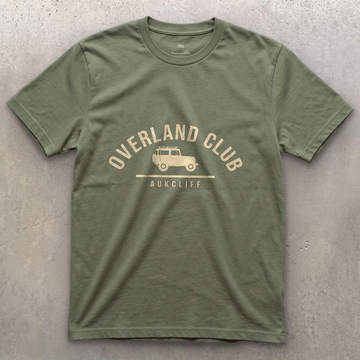 Overland Club Arch Badge, Wagon at the Centre design on a Military Green Gildan Softstyle t-shirt