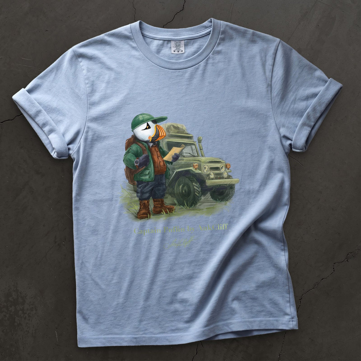 Captain Puffin Overland Explorer on a Washed Denim Comfort Colors t-shirt