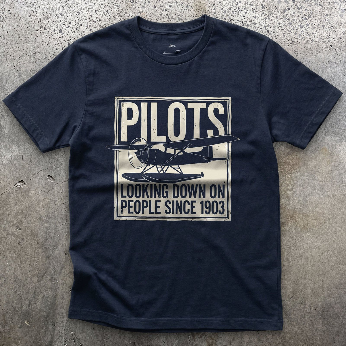 Pilots Looking Down Since 1903 design on a Navy Gildan Softstyle t-shirt