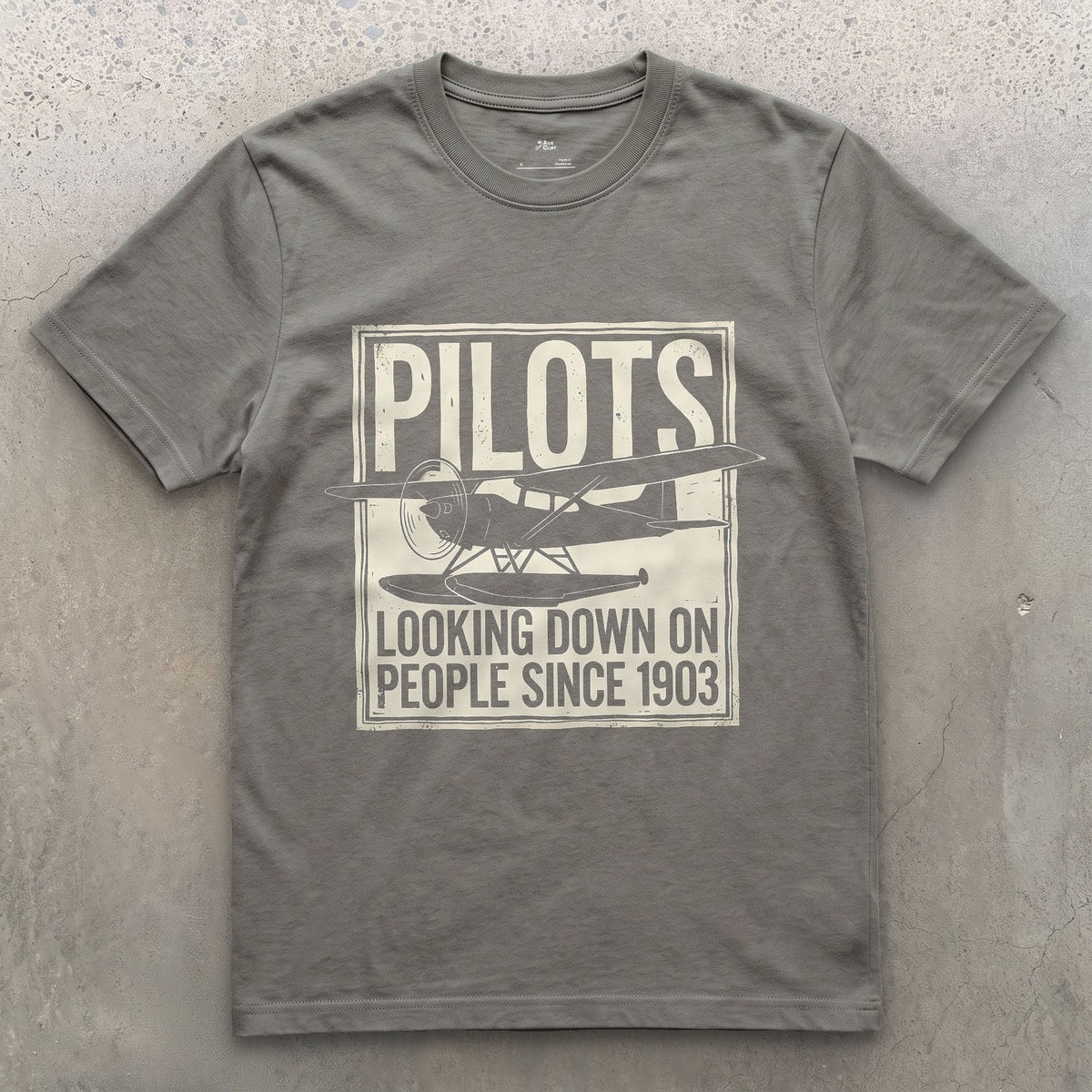 Pilots Looking Down Since 1903 design on a Charcoal Gildan Softstyle t-shirt