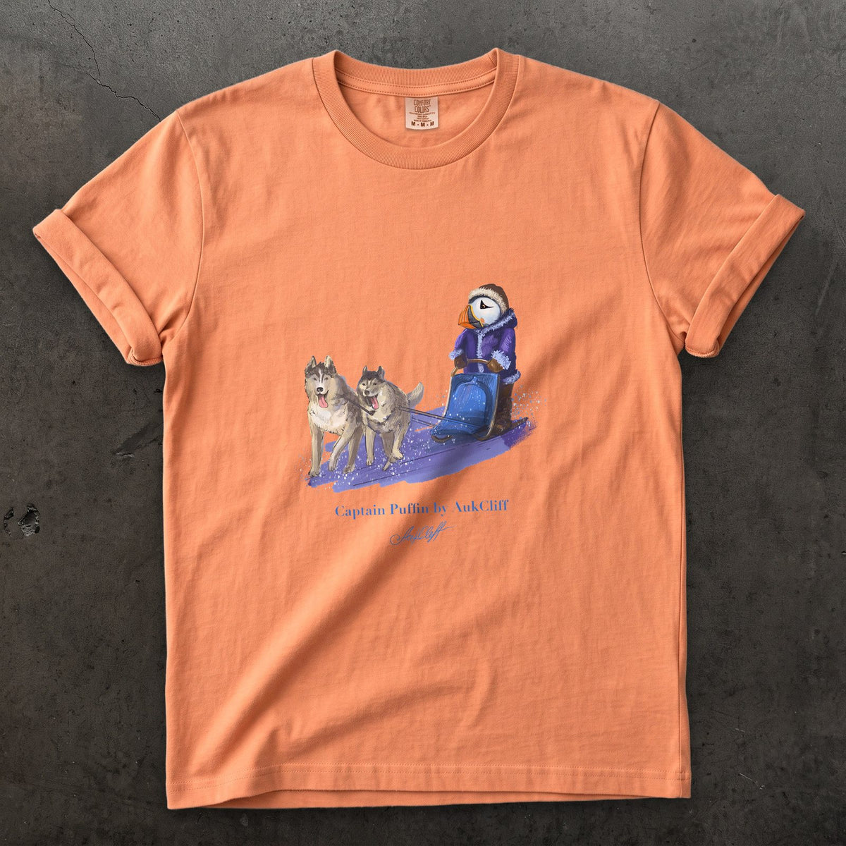 Captain Puffin Arctic Dog Sledder on a Terracotta Comfort Colors t-shirt
