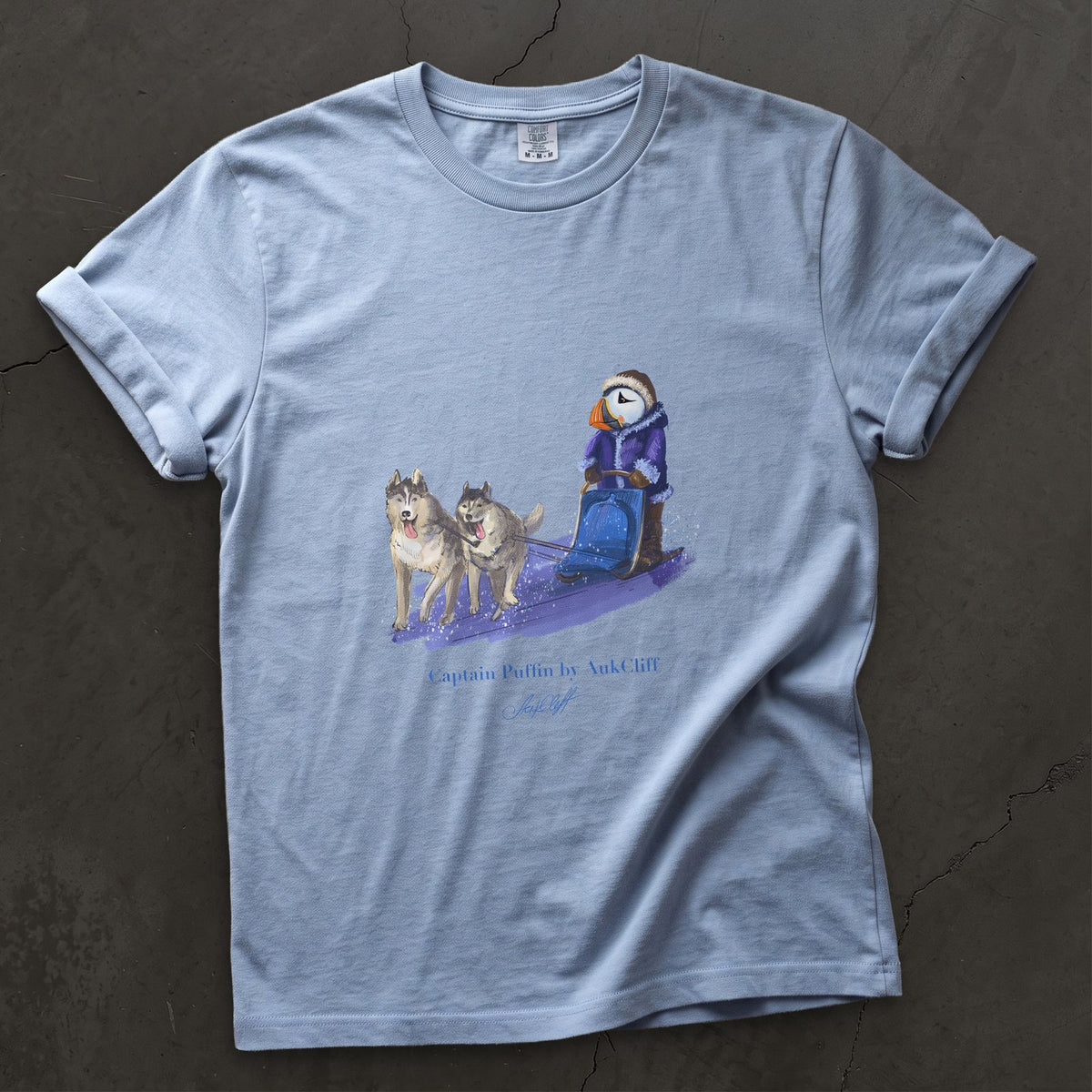 Captain Puffin Arctic Dog Sledder on a Washed Denim Comfort Colors t-shirt