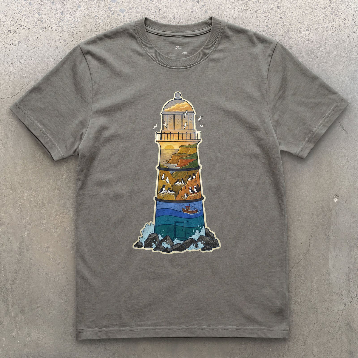 Rocky Headland, Lighthouse design on a Charcoal Gildan Softstyle t-shirt