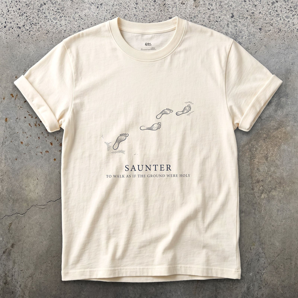 Saunter, to Walk As If the Ground Were Holy design on a Natural Gildan Softstyle t-shirt