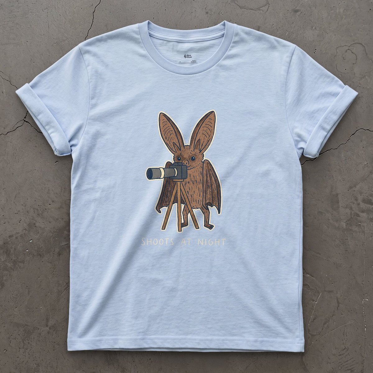 Bat Shoots at Night design on a Light Blue Gildan Softstyle t-shirt