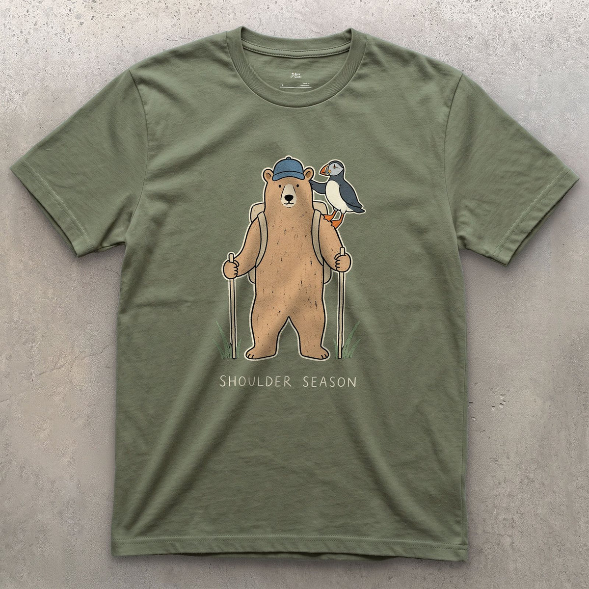 Shoulder Season, Bear and Puffin design on a Military Green Gildan Softstyle t-shirt