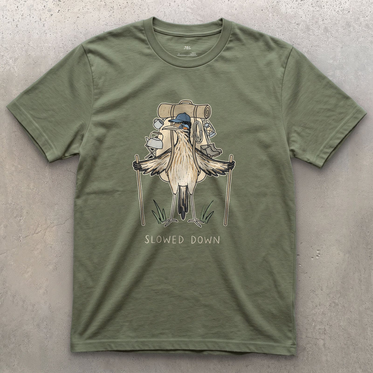 Slowed Down, Roadrunner Hiker design on a Military Green Gildan Softstyle t-shirt