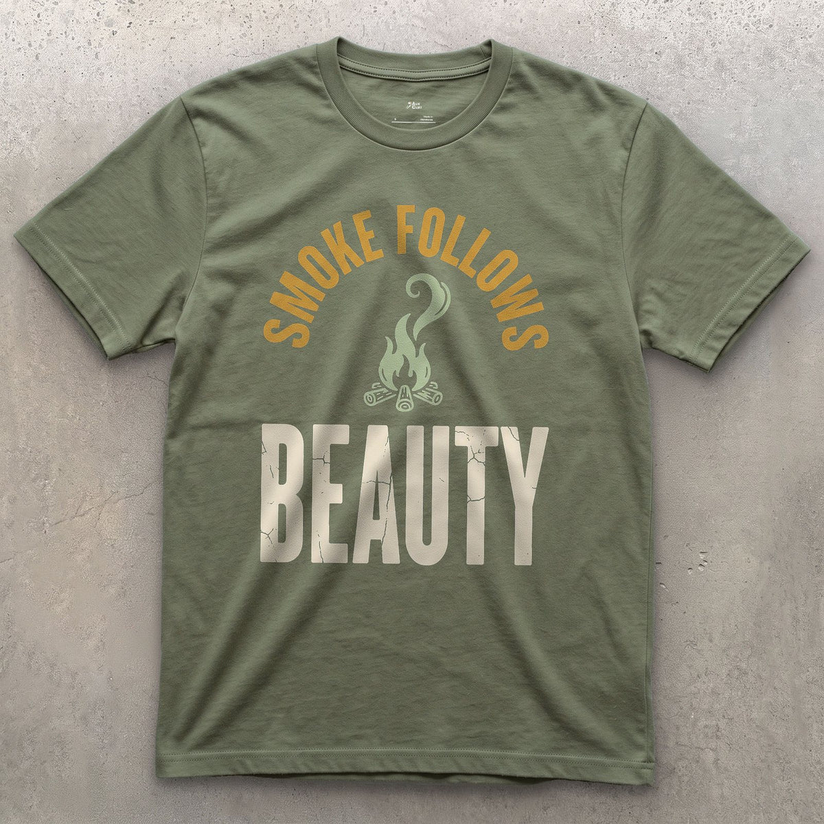 Smoke Follows Beauty, Rising Smoke Badge design on a Military Green Gildan Softstyle t-shirt