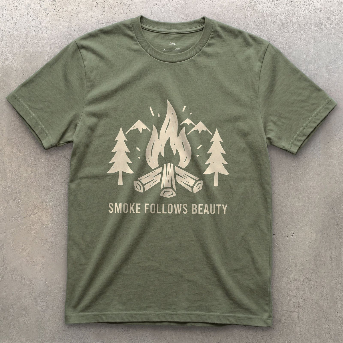 The Smoke Follows Beauty, Mountains and Firewood design on a Military Green Gildan Softstyle t-shirt