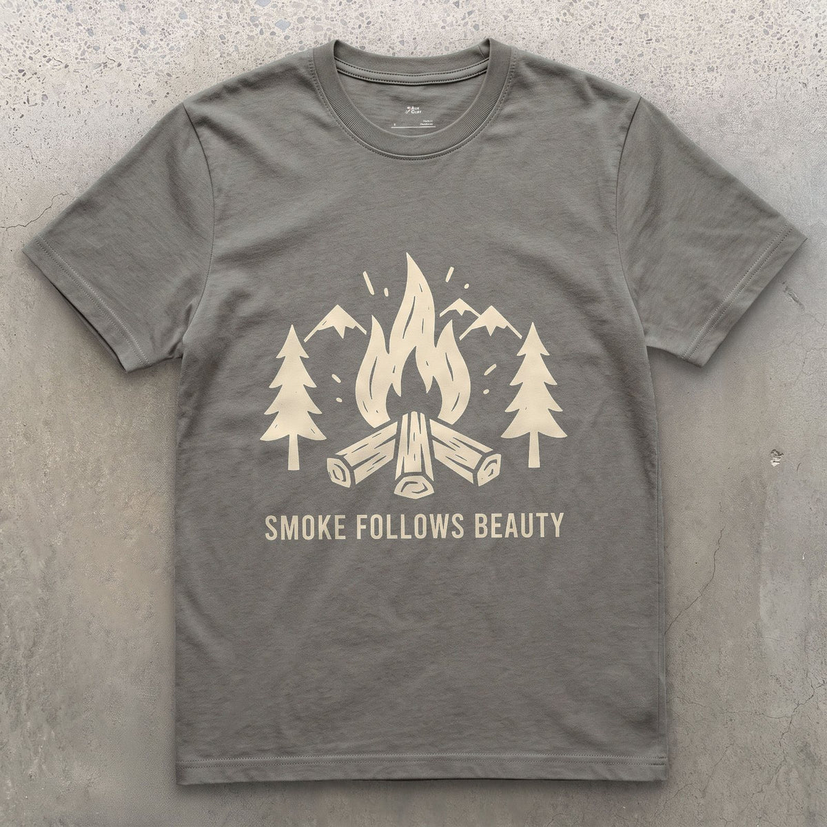 The Smoke Follows Beauty, Mountains and Firewood design on a Charcoal Gildan Softstyle t-shirt