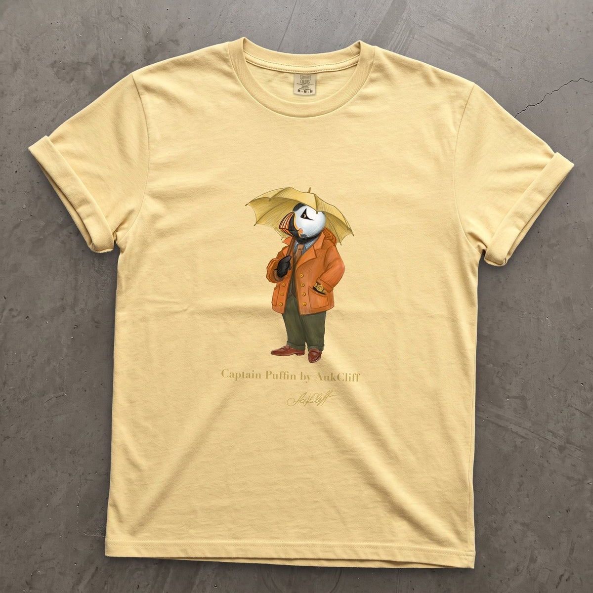 Captain Puffin The Spring Wanderer on a Butter Comfort Colors t-shirt