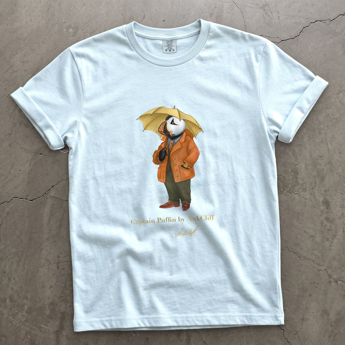 Captain Puffin The Spring Wanderer on a Chambray Comfort Colors t-shirt